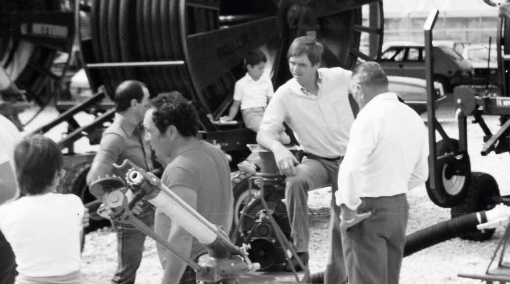 Euromacchine 1979. People discussing irrigation machines at an outdoor fair.