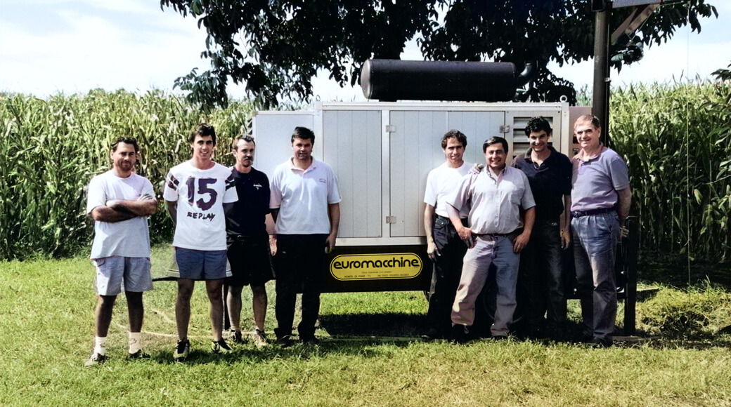 Euromacchine 1999. Euromacchine team posing with equipment in a rural field.