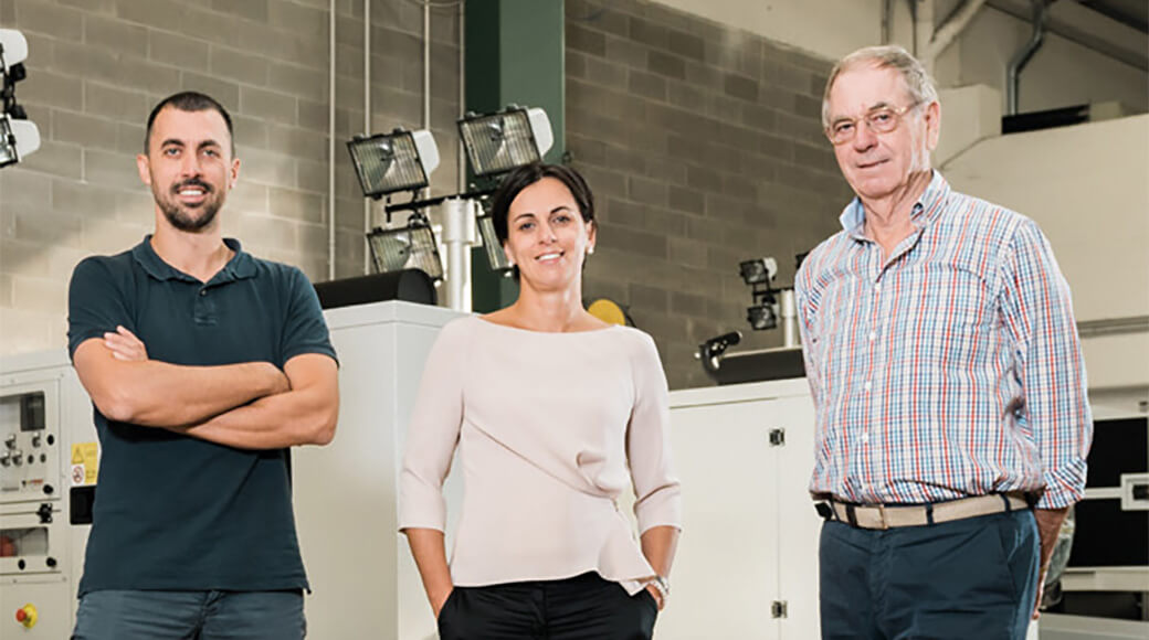 Euromacchine 2012. Three Euromacchine staff members standing inside a workshop.