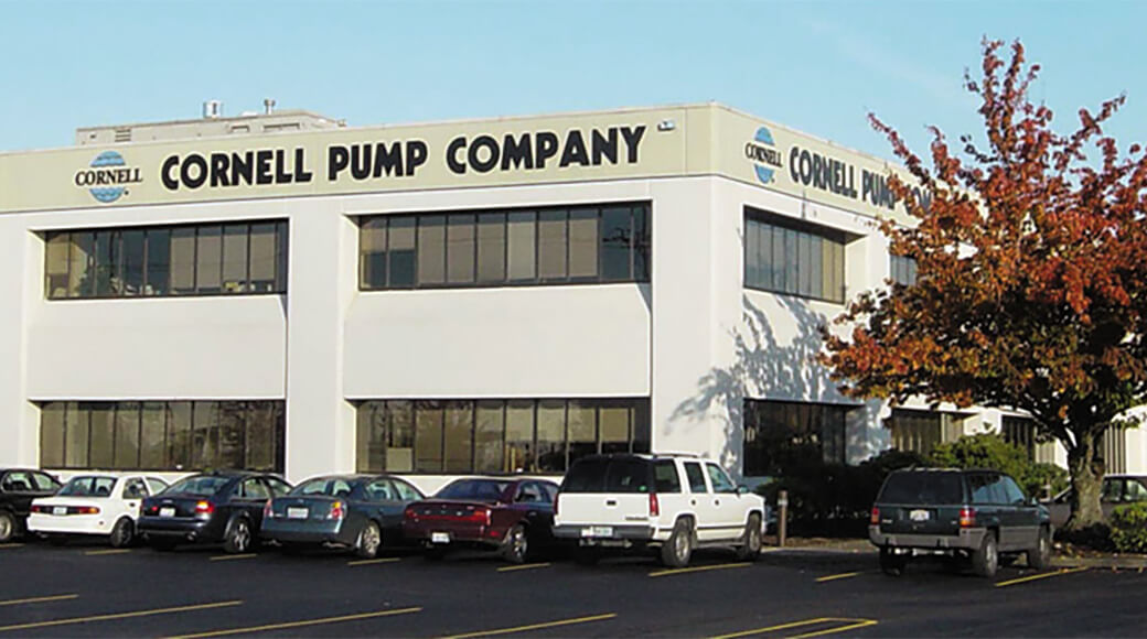 Euromacchine 2014. Cornell Pump Company building exterior with parked cars.