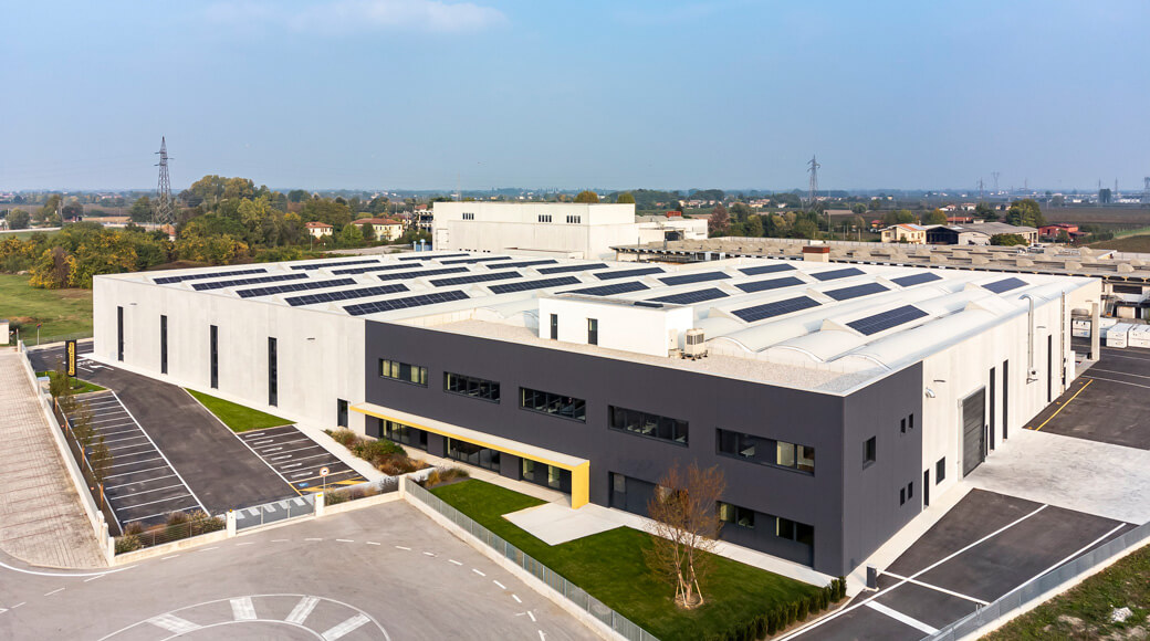 Euromacchine 2022. Aerial view of modern Euromacchine headquarters with solar panels.