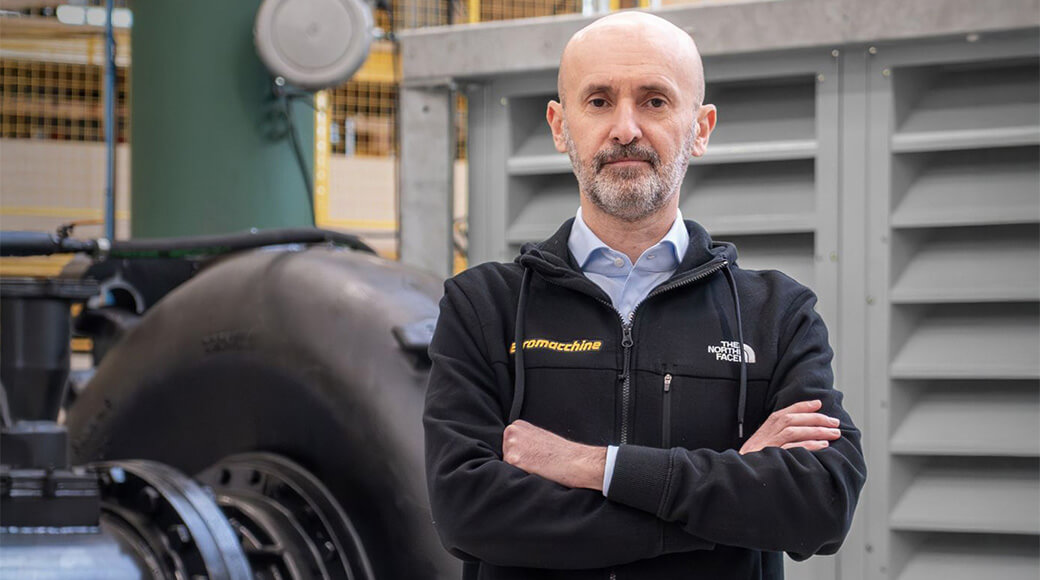 Euromacchine 2025. Euromacchine manager posing in front of industrial equipment.
