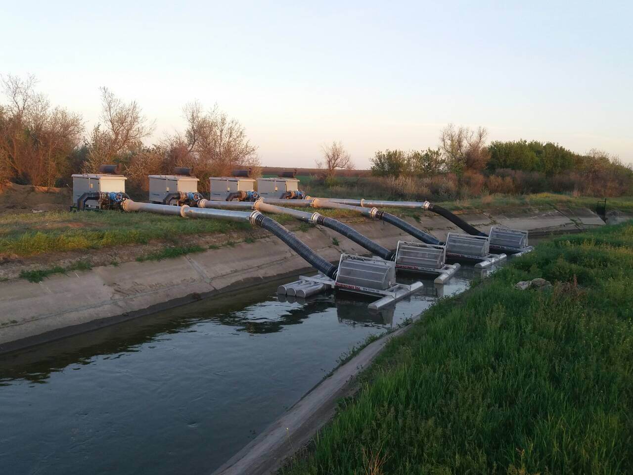Euromacchine irrigation. Multiple pump units transferring water from an irrigation canal.