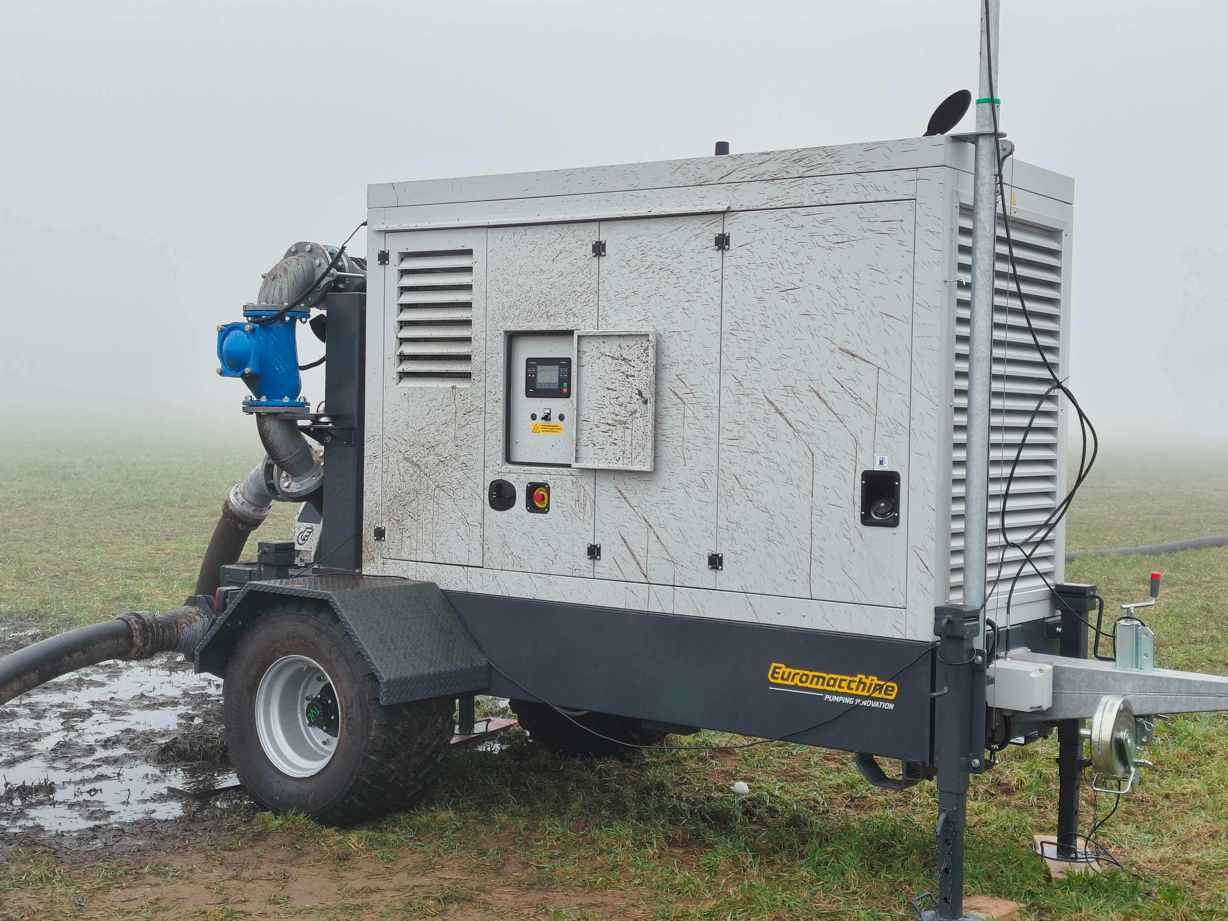 Euromacchine manure. Mobile pump unit operating in a muddy agricultural field.